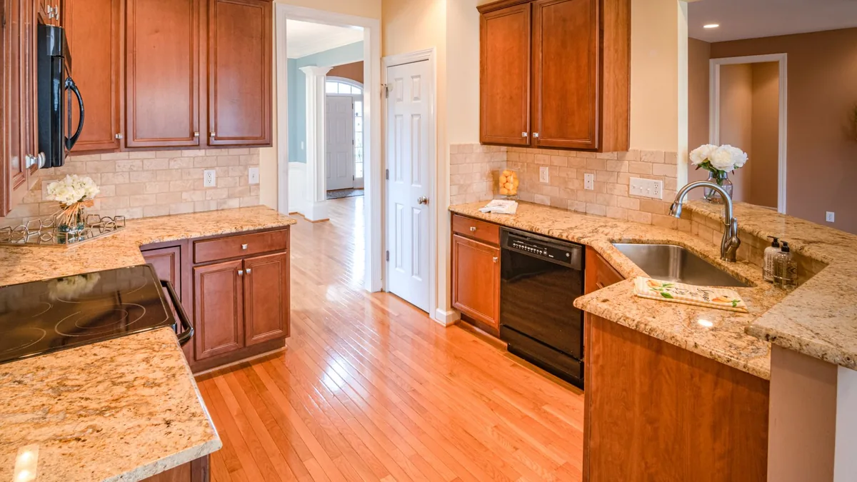 Installer setting kitchen cabinets in a Sunnyvale, CA kitchen